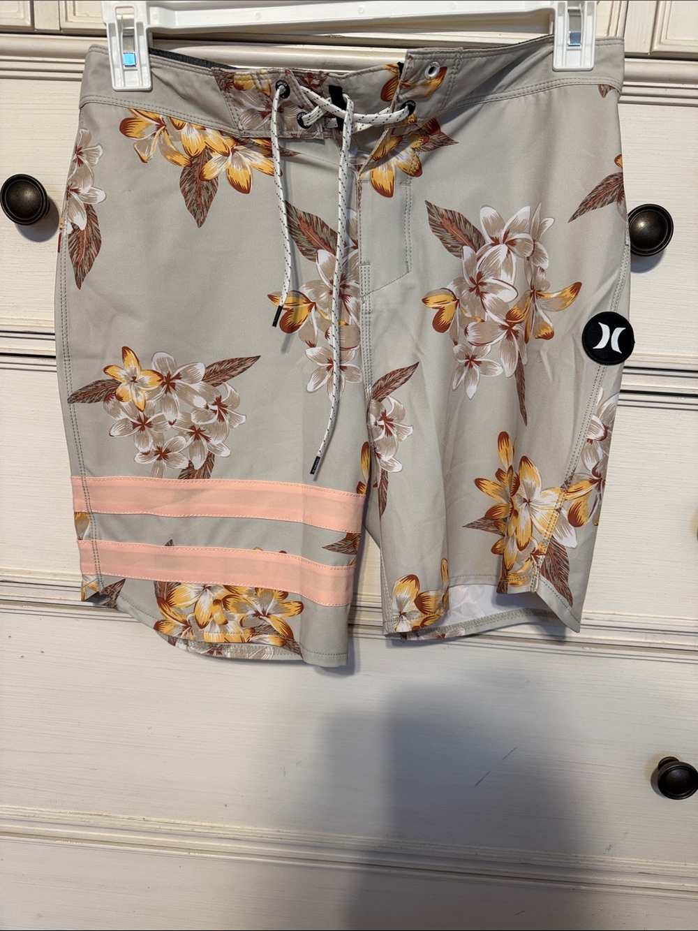 Hurley beige floral swim trunks with orange accents